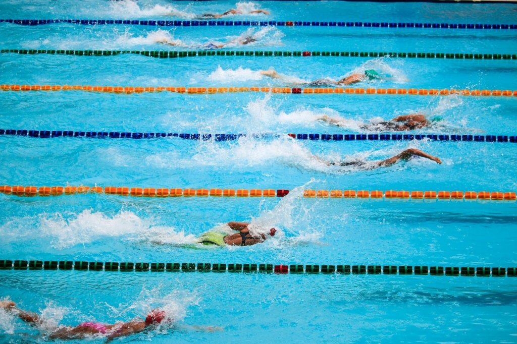 learn how to swim to compete